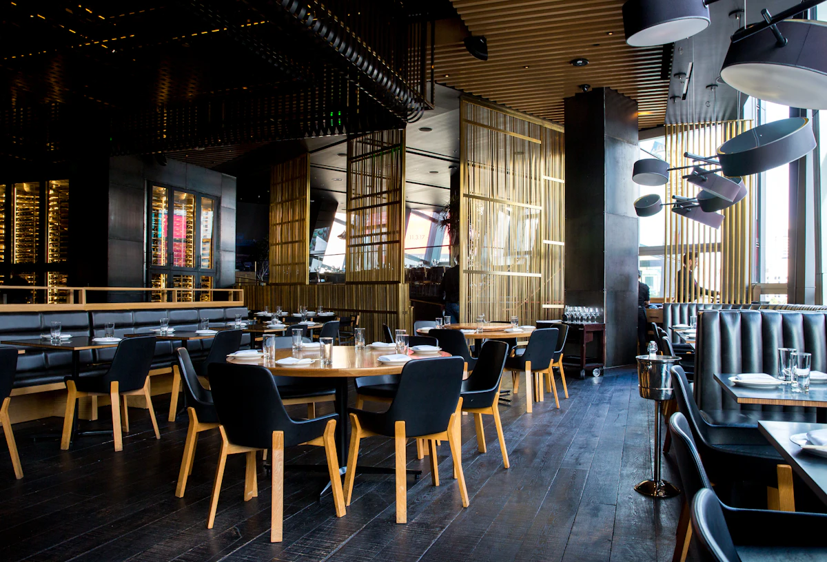 The dining room in low light with tables laid